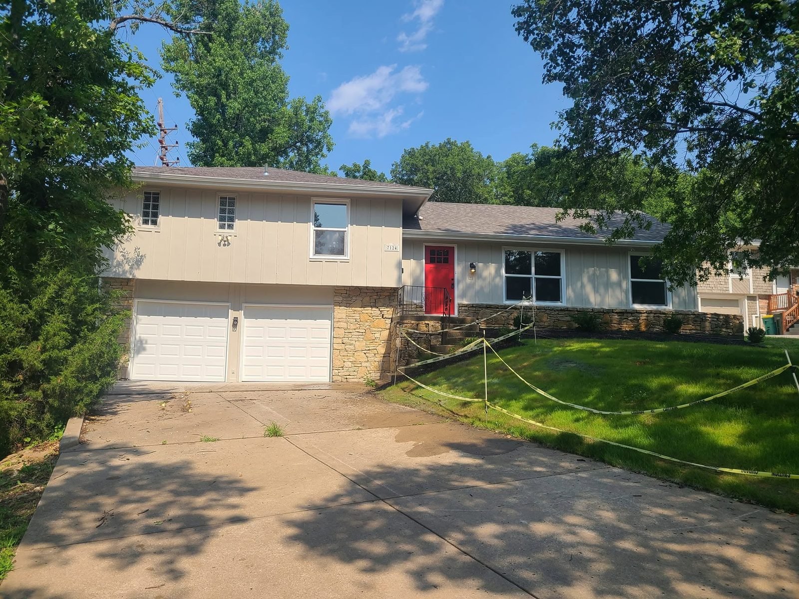 Finished split-level exterior with repainted facade