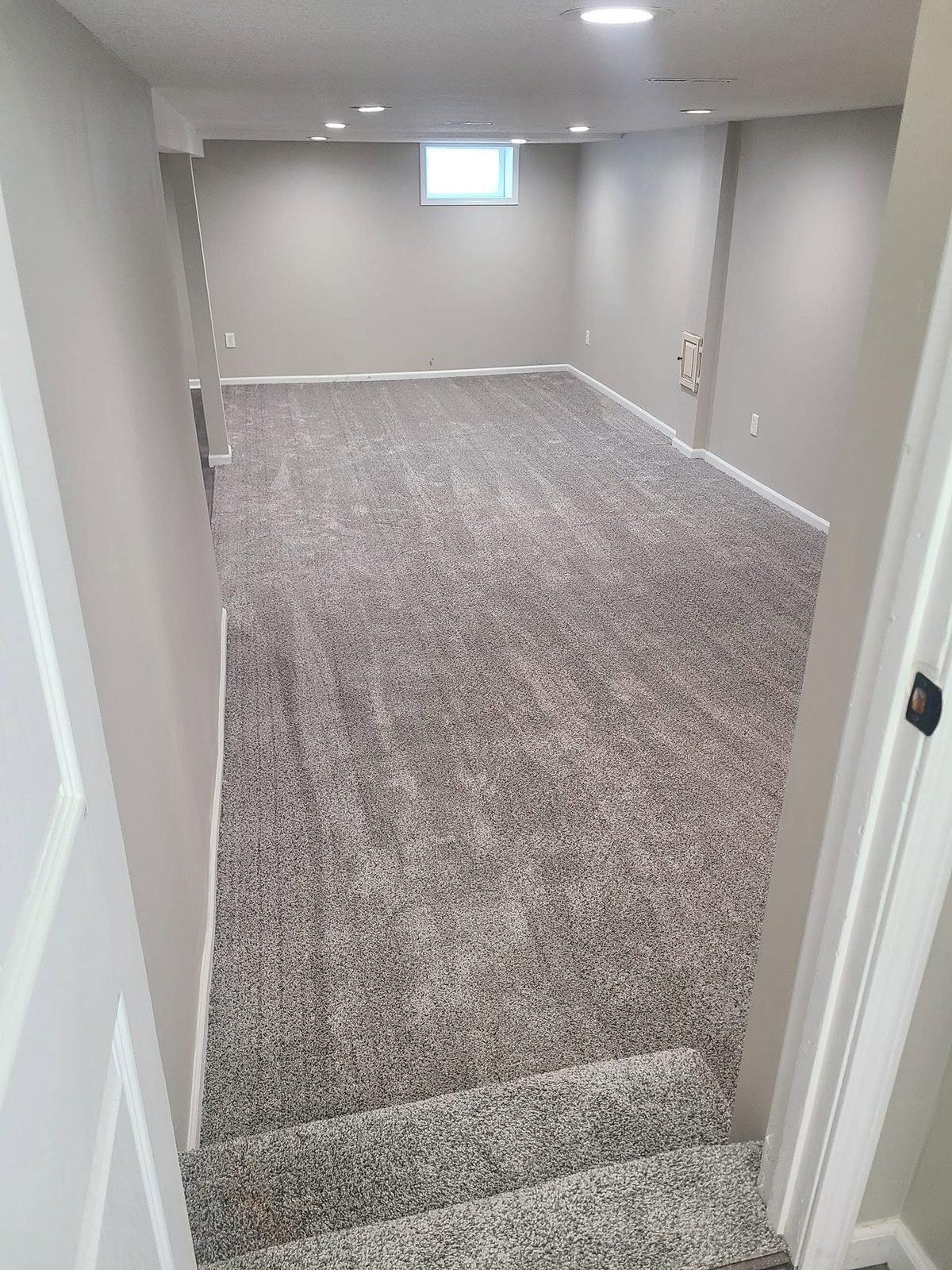 Finished basement with new carpet